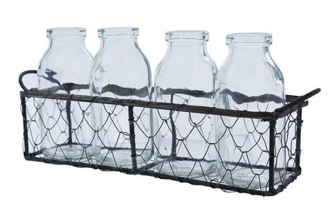 Four Cream Bottles Sitting In A Wire Crate -Decorative Chic for BBQs